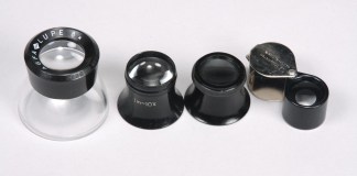From left to right: A photographer’s loupe, two watchmaker’s loupes, and a folding pocket loupe.
