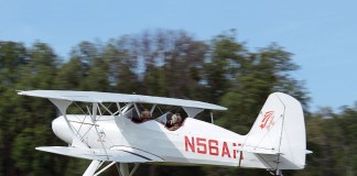 Old School Solution Starduster biplane over grass strip
