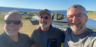 Marc Cook, Tom Hamilton, and Omar Filipovic at AirVenture 2022. Tom Hamilton is the designer of the GlaStar experimental, seen in the background.