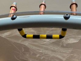 Finished egress handle with striping, fastened in place with #8 screws.
