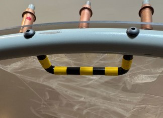 Finished egress handle with striping, fastened in place with #8 screws.