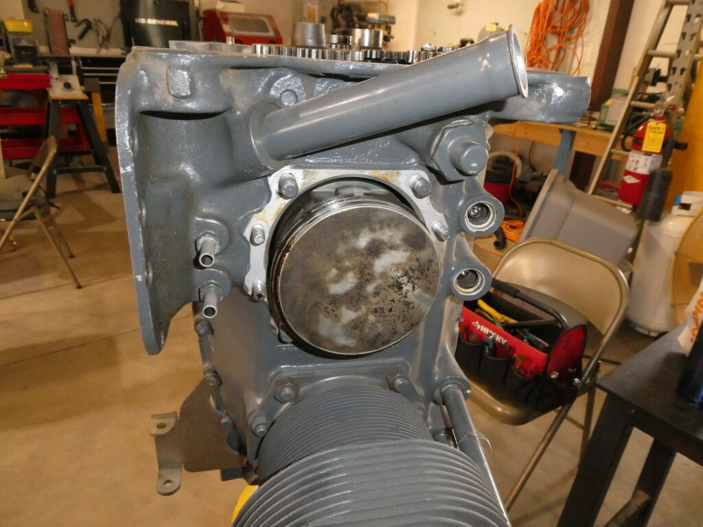 Goo is visible on the left side of the piston, plus the rings are defying gravity due to being firmly stuck.