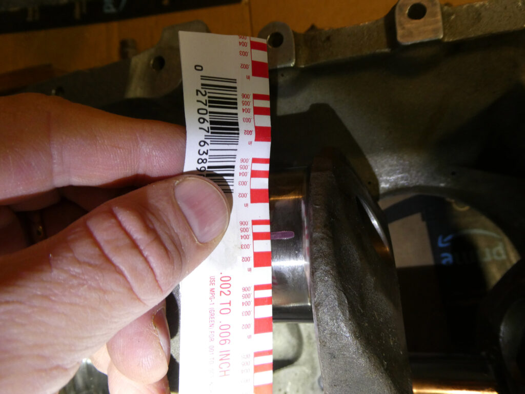 Using Plastigauge to check bearing clearances, about 0.004 inch in this case.