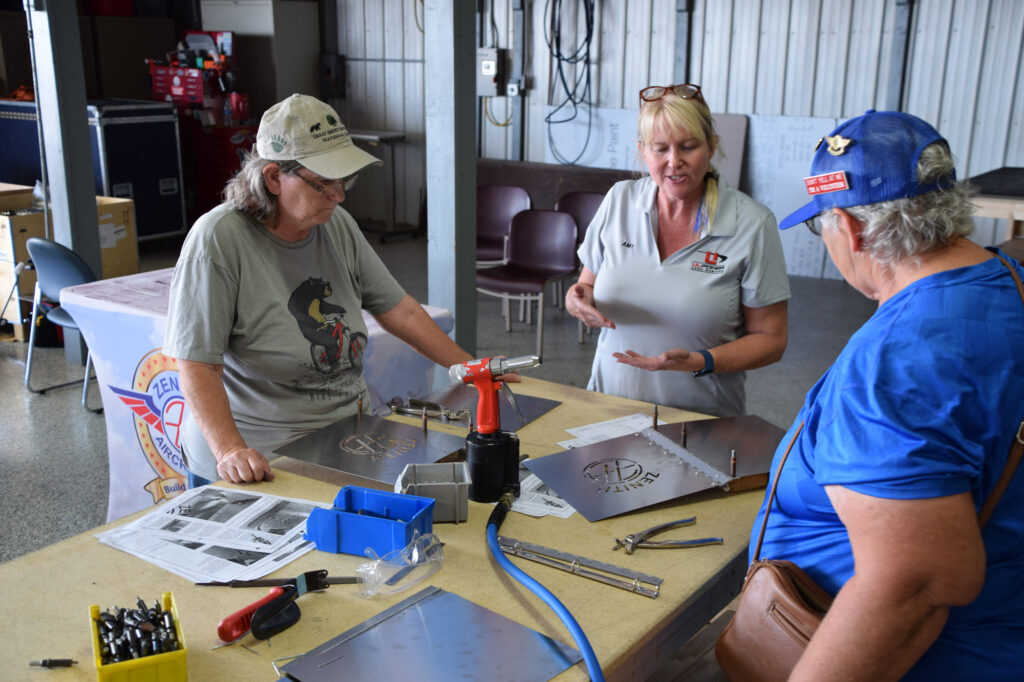 Participants in the 2025 Zenith Homecoming Women’s Workshop
compare notes and talk about building techniques.