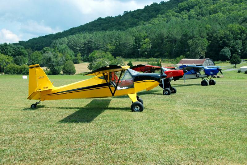 Two Highlanders and a SuperSTOL XL in the backgound on a perfect flying day.