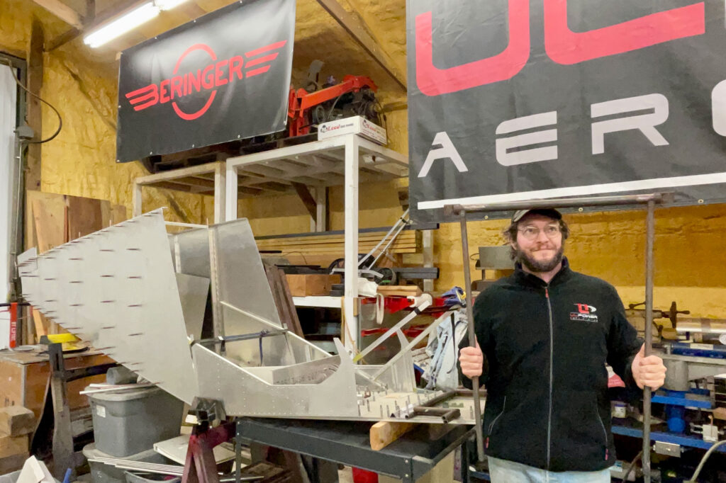 Jon holding the cromoloy forward cabin frame that will soon be replaced with titanium. [Credit: Jon Humberd]