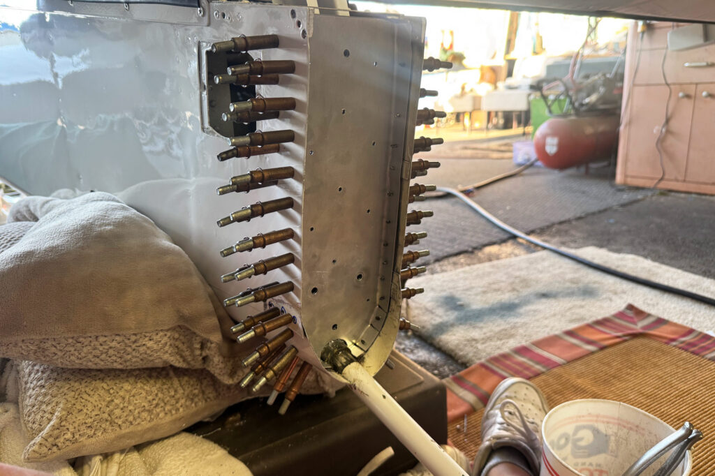 Before riveting we clecoed the new bulkhead in place. [Credit: Tinley Ong]