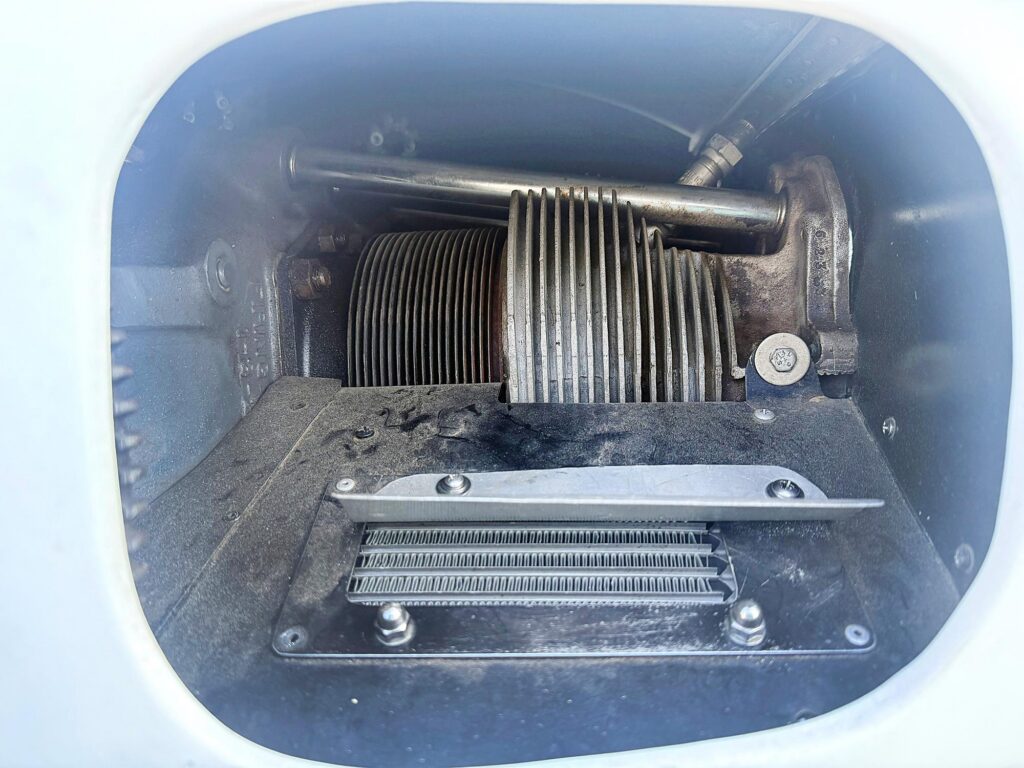 Air coming into the cowling will pile up in front of the air dam and form a high pressure area that will then flow down through the oil cooler. [Credit: Andrew Robinson]