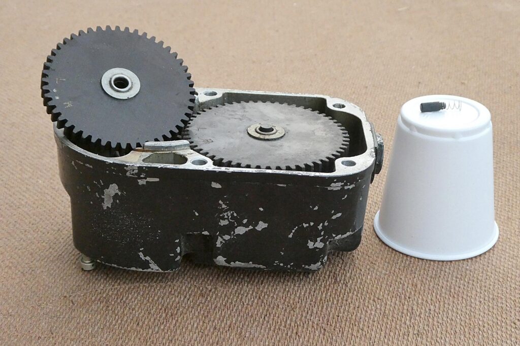 The carbon brush on its spring before being fully inserted into the rotor.
