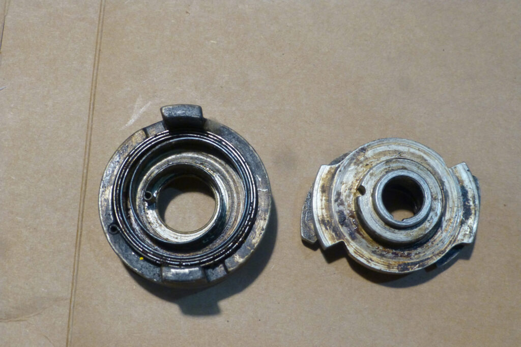 The inside of the impulse coupling. Bottom part with the flyweights is on the right.