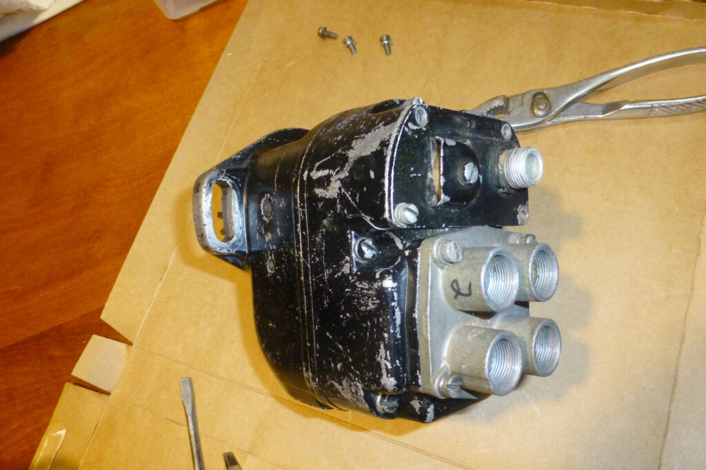 The aft face of the magneto where the P-lead and the plug wires are inserted.