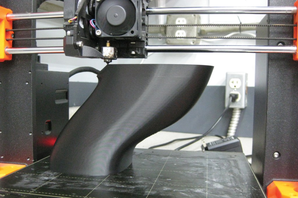 3D printer fabbing up a mock cooling duct.