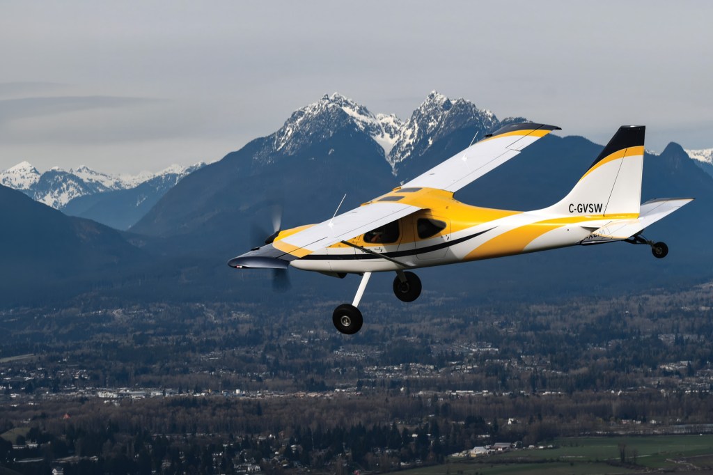 The Glasair Sportsman flying with the Canadian Goldenears Mountains in the background.