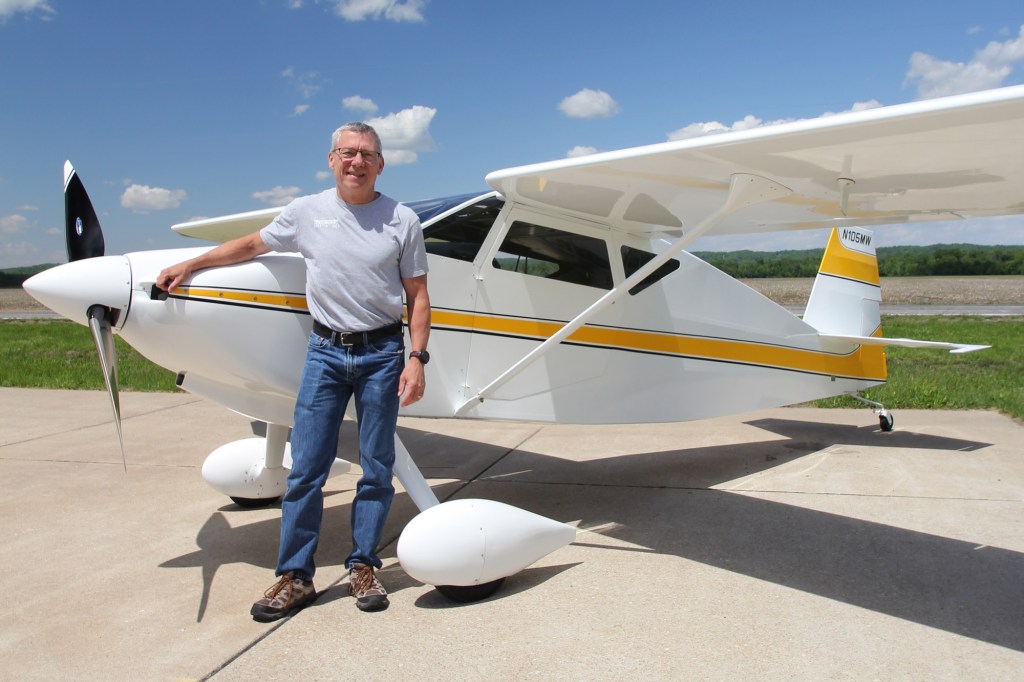 Mike Wilson spent 30 years building his Wittman W-10 Tailwind. He’s shown on the ramp at St. Charles, Missouri, with N105MW. [Credit: LeRoy Cook]