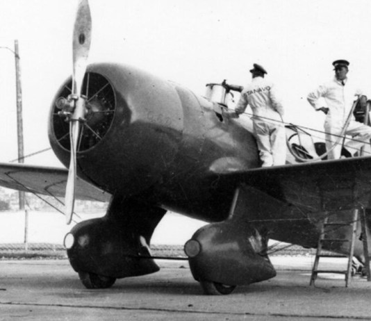 The Granville Brothers Gee Bee R-6 “Q.E.D.” being serviced before the 1934 MacRobertson Air Race; Mid America Flight Museum flies a replica of this aircraft. [Credit: Wikimedia Commons]