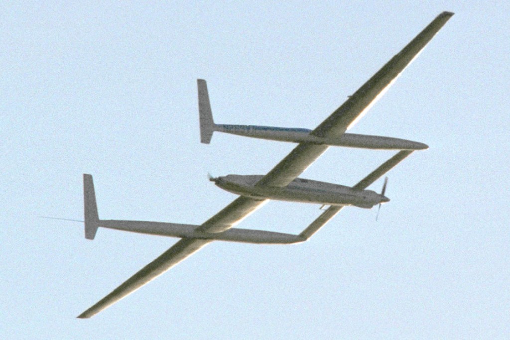 The Rutan Model 76 Voyager circles Edwards Air Force Base in December 1986 as Dick Rutan and Jeana Yeager complete the first nonstop, unrefueled flight around the world. [Credit: NASA Armstrong Flight Research Center]