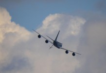 The week ahead: a KC-135 tanker passes over the grounds at EAA AirVenture Oshkosh, where Phillips 66 will set up at tents #430 and #431. [Credit: USDA Forest Service]