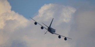 The week ahead: a KC-135 tanker passes over the grounds at EAA AirVenture Oshkosh, where Phillips 66 will set up at tents #430 and #431. [Credit: USDA Forest Service]