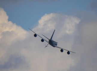 The week ahead: a KC-135 tanker passes over the grounds at EAA AirVenture Oshkosh, where Phillips 66 will set up at tents #430 and #431. [Credit: USDA Forest Service]