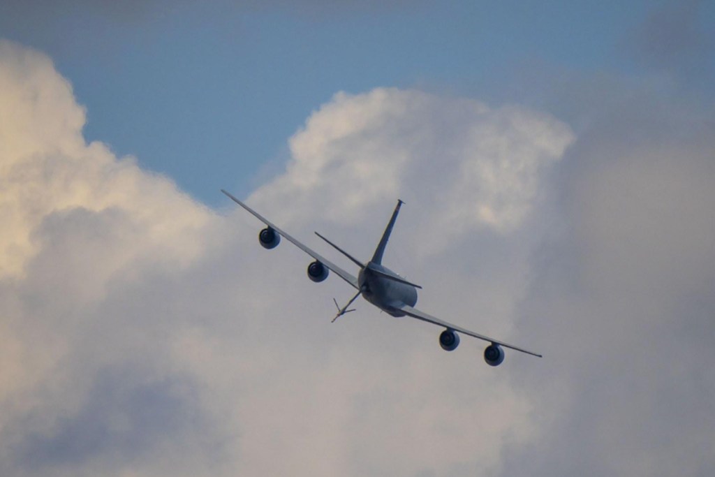 The week ahead: a KC-135 tanker passes over the grounds at EAA AirVenture Oshkosh, where Phillips 66 will set up at tents #430 and #431. [Credit: USDA Forest Service]