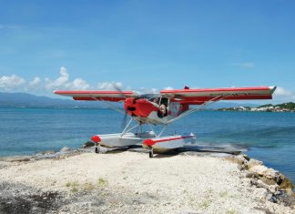A Zenith STOL CH701 on Zenair amphibious floats rests on a sandbar on the Caribbean island of Guadeloupe. [Credit: Zenith Aircraft]