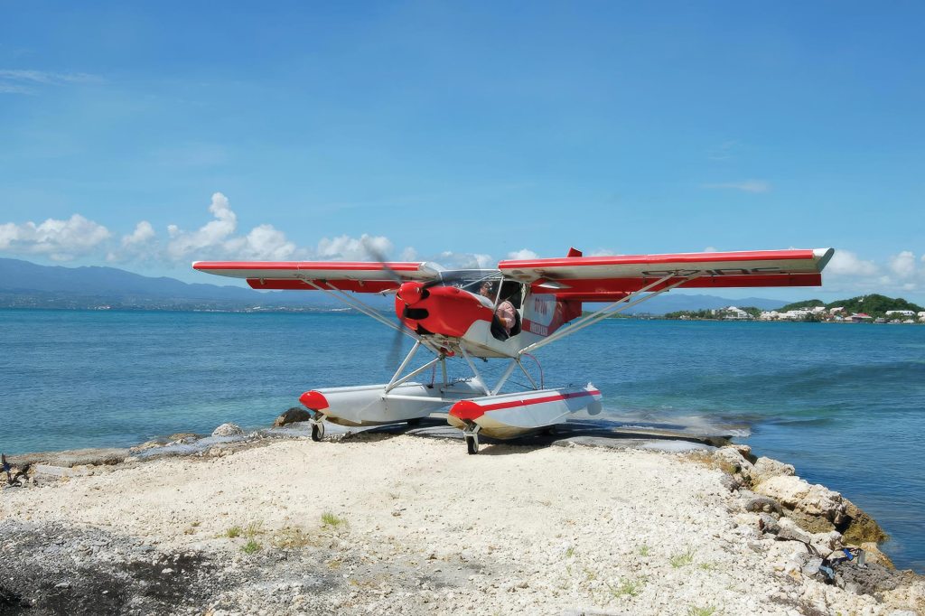A Zenith STOL CH701 on Zenair amphibious floats rests on a sandbar on the Caribbean island of Guadeloupe. [Credit: Zenith Aircraft]