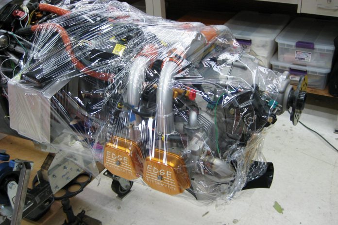 The engine is wrapped in plastic to protect it from any dripping epoxy while fitting the cowl with liquid shims.