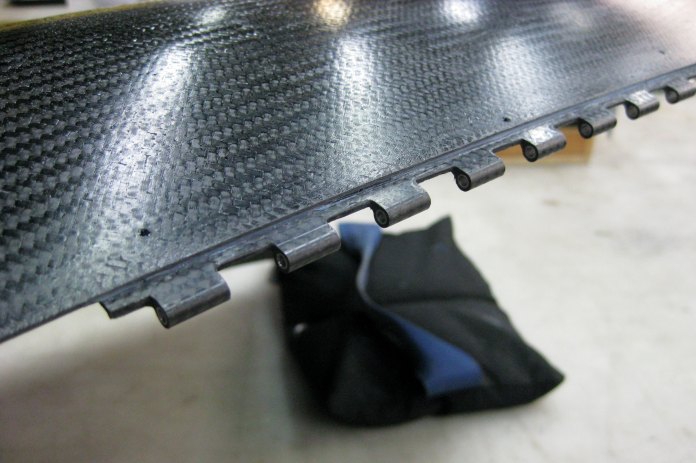 Carbon fiber piano hinges join the lower left and right cowl halves. Everywhere else the cowl assembles with #8 screws and nutplates.