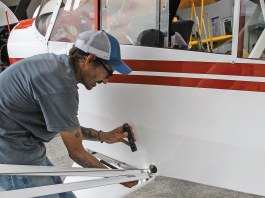 Maintenance technician William Vergonet conducts an inspection on a Cub. [Credit: Lisa Turner]