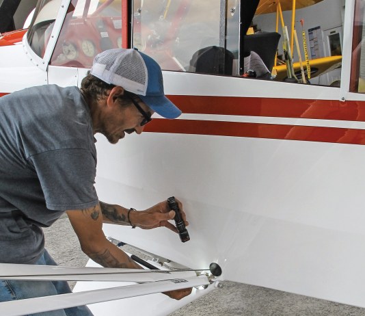 Maintenance technician William Vergonet conducts an inspection on a Cub. [Credit: Lisa Turner]