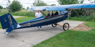 R.T. Searfoss shows off his magnificent workmanship in the Pietenpol Air Camper he built over the span of 12 years. There is much to love in classic tube and fabric aircraft which harken back to an earlier time of aircraft construction. Masterful craftsmanship is everywhere you look in R.T.’s work. [Credit: Bill Wilson]