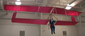 Red biplane hang glider